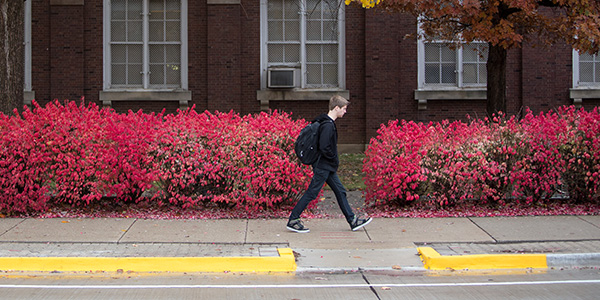 Student walking across campus.